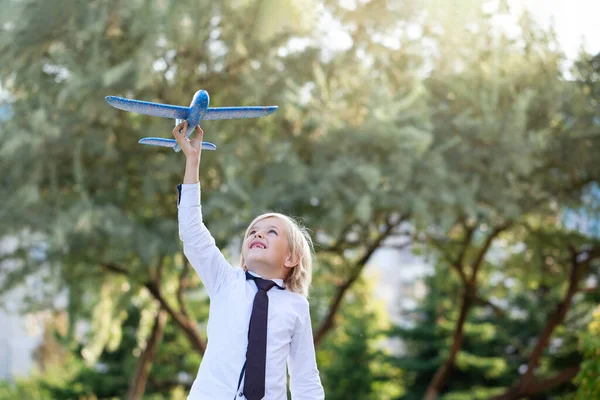 Handsome Child Boy Toothless Smile White Shirt Plays Toy Airplane — Stock Photo, Image