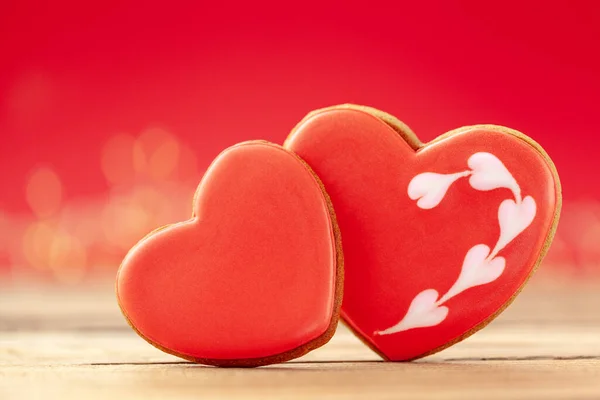 Red heart shaped gingerbread for Valentines Day, Mother Day or Birthday on red background — Stock Photo, Image