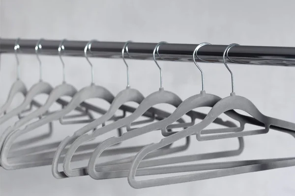 Modern Velvet Grey Empty Hangers Neutral Wall Background — Stock Photo, Image