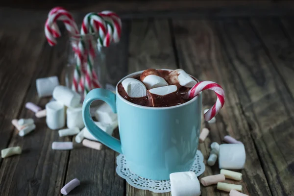 Mug filled with hot chocolate and marshmallow  and candy canes i — Stock Photo, Image
