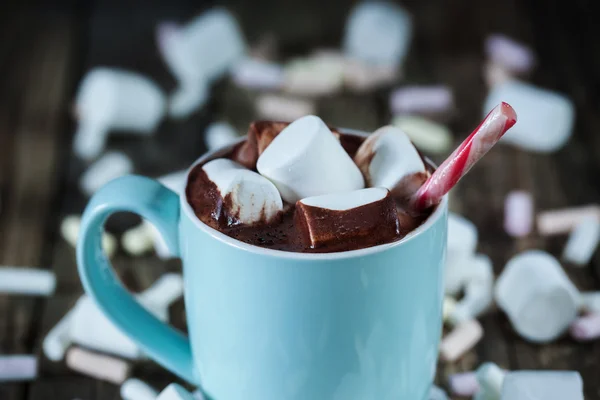 Mug filled with hot chocolate and marshmallow  and candy, coseup — Stock Photo, Image