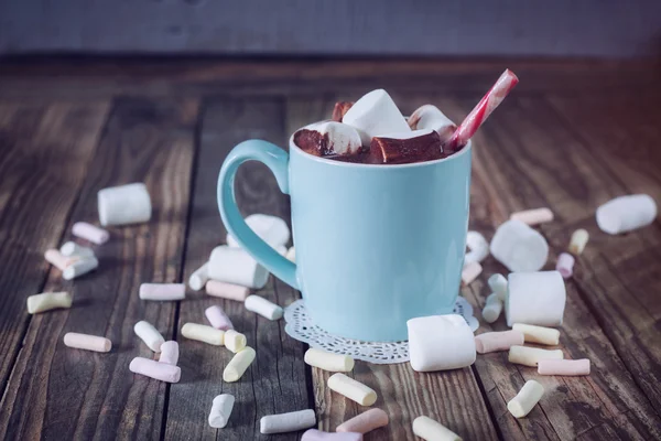 Mug filled with hot chocolate and marshmallow  and candy canes, — Stock Photo, Image