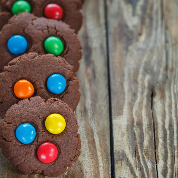 Homemade  chocolate cookies decorated with multi-colored candy d — Stock Photo, Image