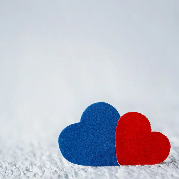 Red Heart and Blue Heart on white wood background. Valentines Da