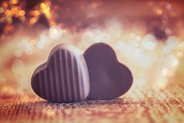 Two Chocolates Hearts on a wooden background,  valentines day. — Stock Photo, Image