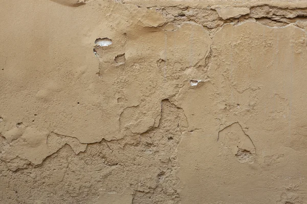 Old ochre painted stucco wall — Stock Photo, Image