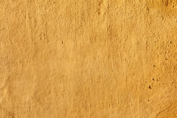 Yellow stucco wall. — Stockfoto