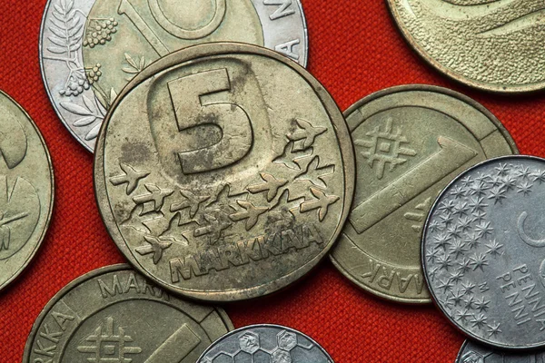 Coins of Finland on red table — Stock Photo, Image