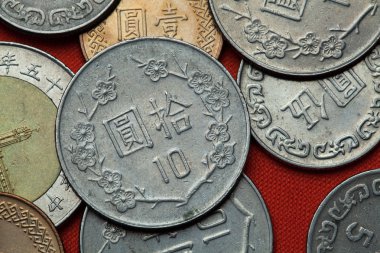 Coins of Taiwan on red table clipart