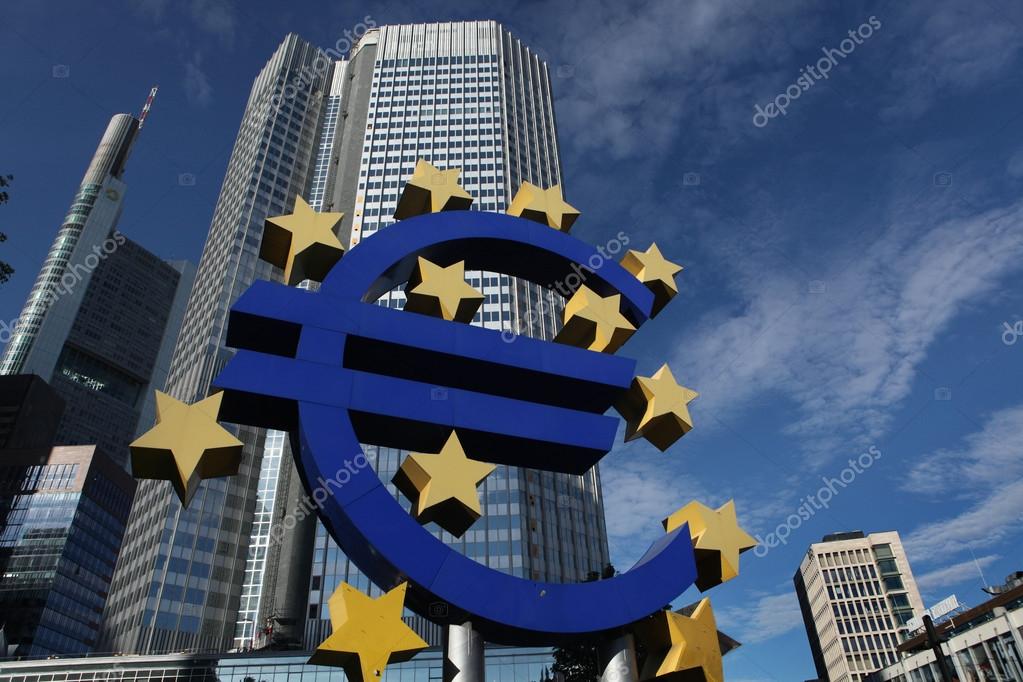 FRANKFURT AM MAIN, GERMANY - JUNE 14, 2015: Euro logo by German visual artist Ottmar Horl in front of the Eurotower in Frankfurt am Main, Hesse, Germany.