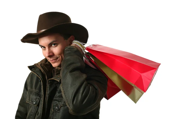 Joven sexy hombre con bolsas de compras —  Fotos de Stock