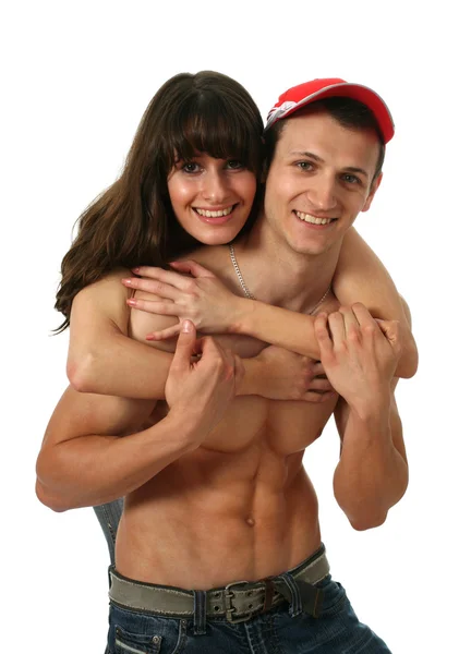 Mujer abrazando su musculoso novio — Foto de Stock