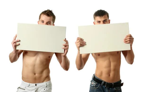 两个性感男人显示副本空间空白广告牌 — 图库照片
