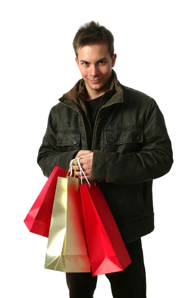 Hombre joven con bolsas de compras — Foto de Stock