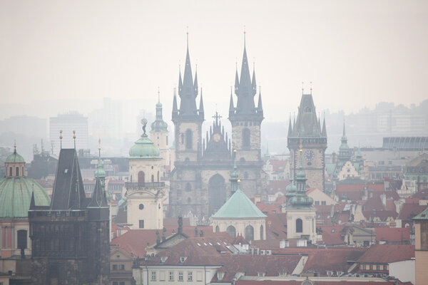 Tyn Church and the Old Town Hall in Old Town Square viewed from Petrin Hill in Prague, Czech Republic.