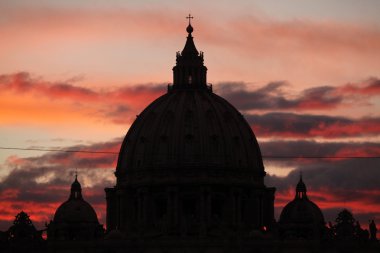 Sunset over  Saint Peter's Basilica clipart