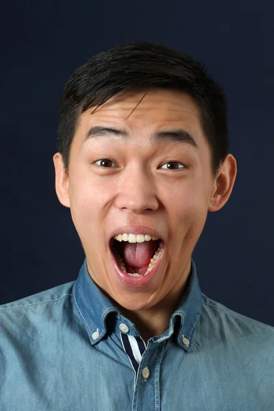 Surprised young Asian man — Stock Photo, Image