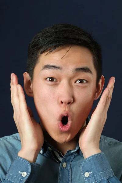 Surprised young Asian man — Stock Photo, Image