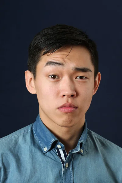 Serious young Asian man — Stock Photo, Image