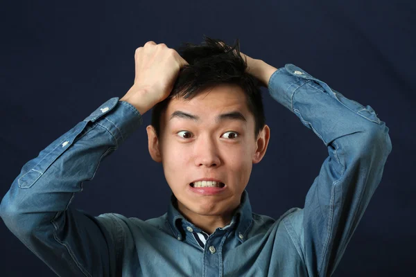 Disappointed young Asian man — Stock Photo, Image