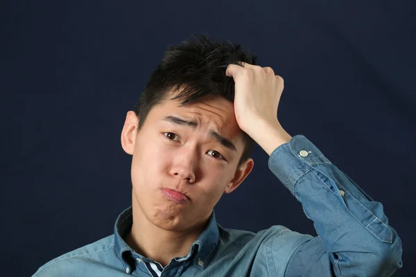 Disappointed young Asian man — Stock Photo, Image