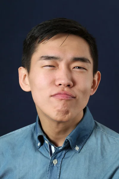 Asian man making face — Stock Photo, Image