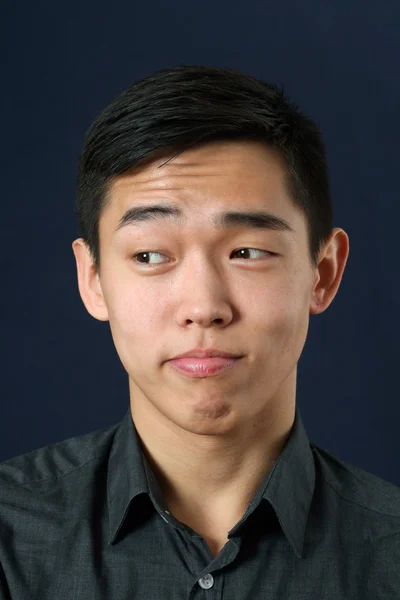 Asian man rising eyebrows — Stock Photo, Image