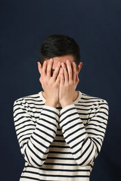 Man covering his face by palms — Stock Photo, Image