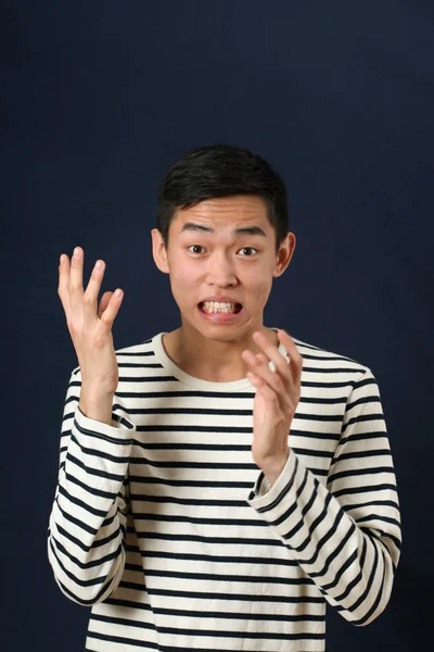 Displeased young asian man — Stock Photo, Image