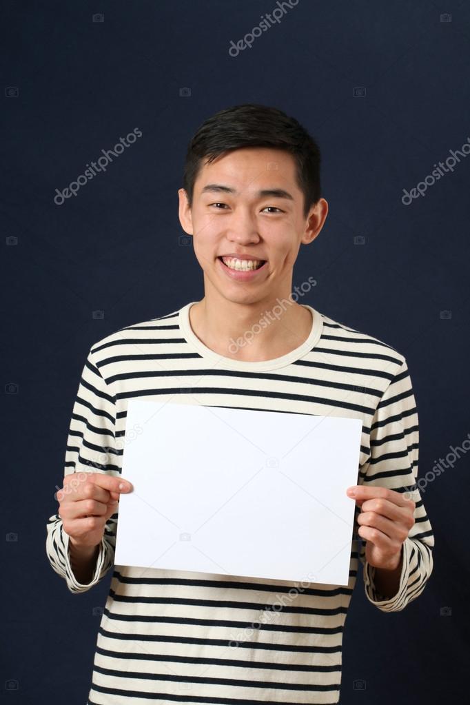 Man showing white page