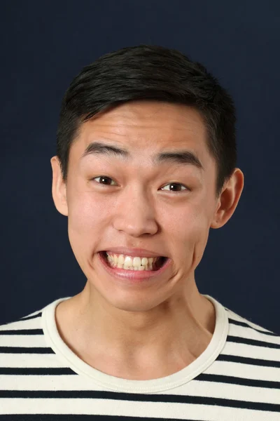 Laughing young Asian man — Stock Photo, Image