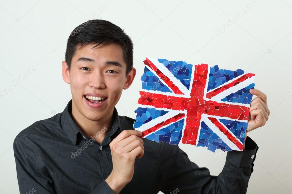 Asian student showing UK national flag