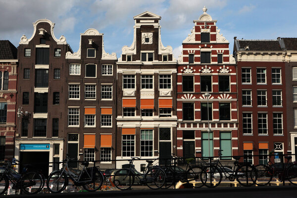 Bicycles parked in front of the brick houses