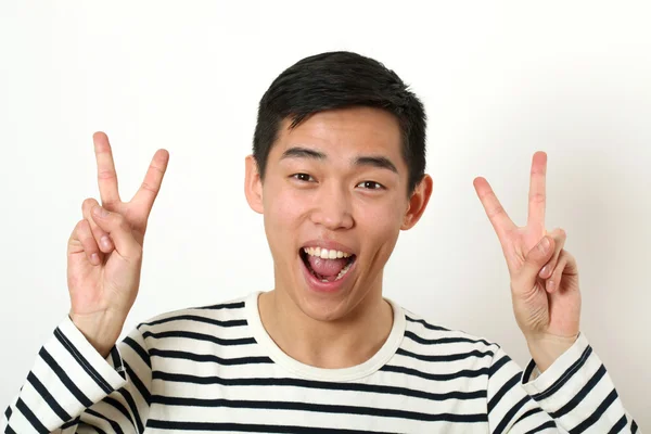 Laughing young Asian man — Stock Photo, Image