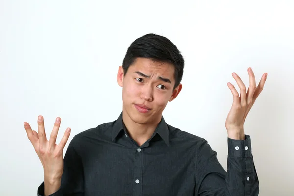 Displeased Asian man — Stock Photo, Image