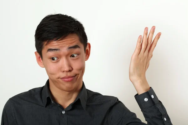 Displeased Asian man — Stock Photo, Image