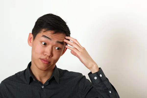 Thoughtful  Asian man — Stock Photo, Image