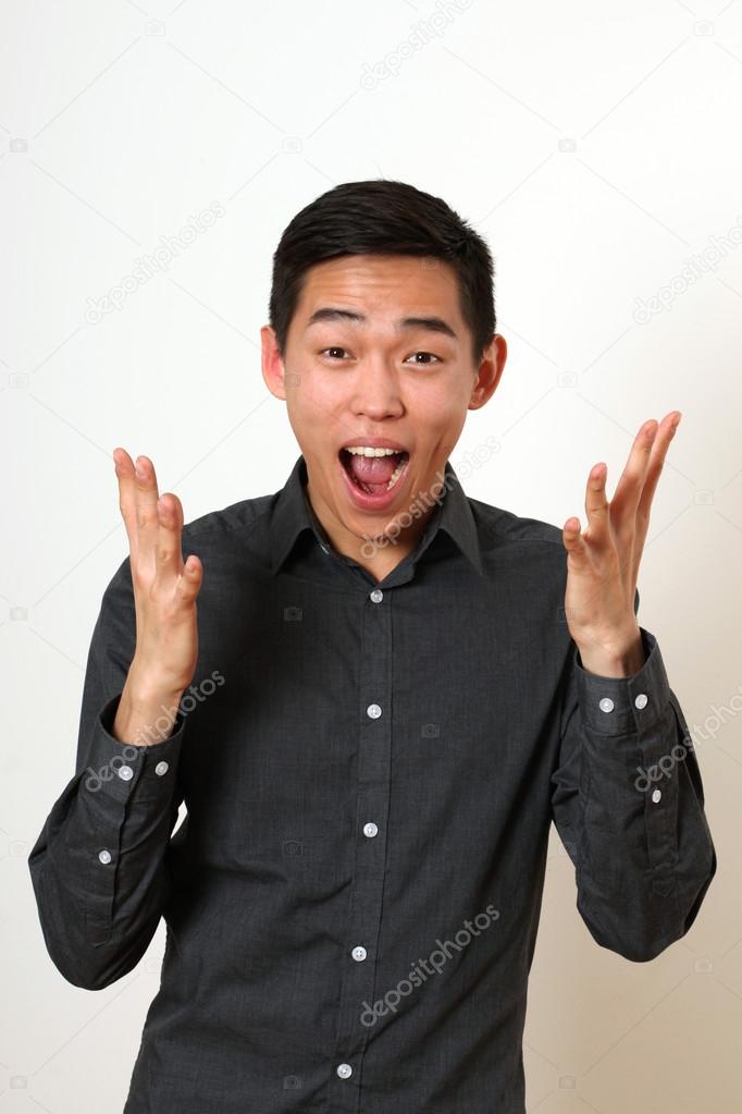 Laughing young Asian man