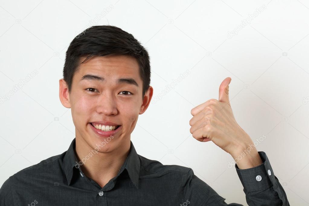 Asian man giving the thumb up sign
