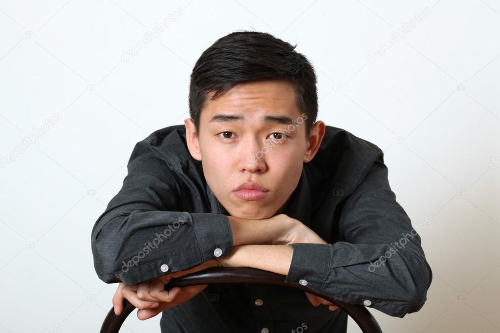 Thoughtful Asian man