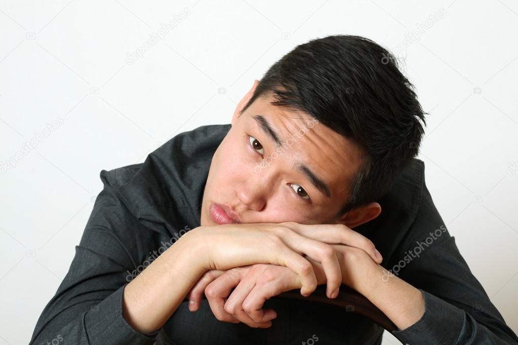 Thoughtful Asian man