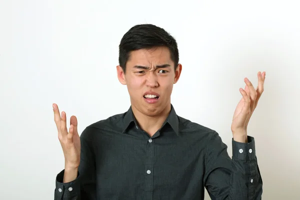 Displeased Asian man — Stock Photo, Image