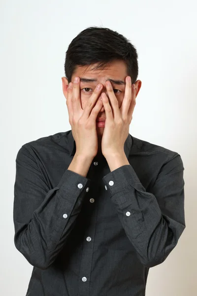 Frustrated Asian man — Stock Photo, Image