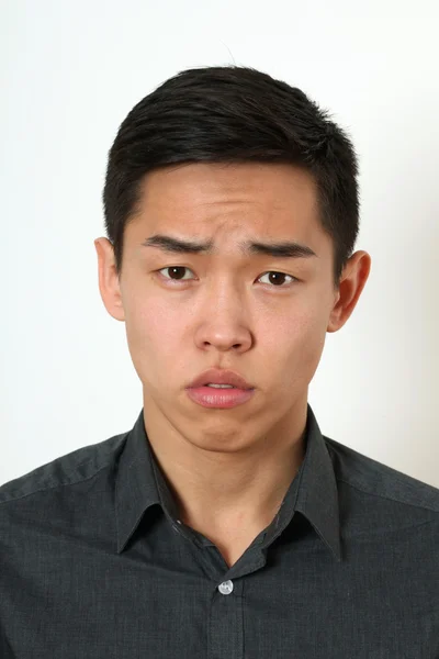 Strict young Asian man — Stock Photo, Image