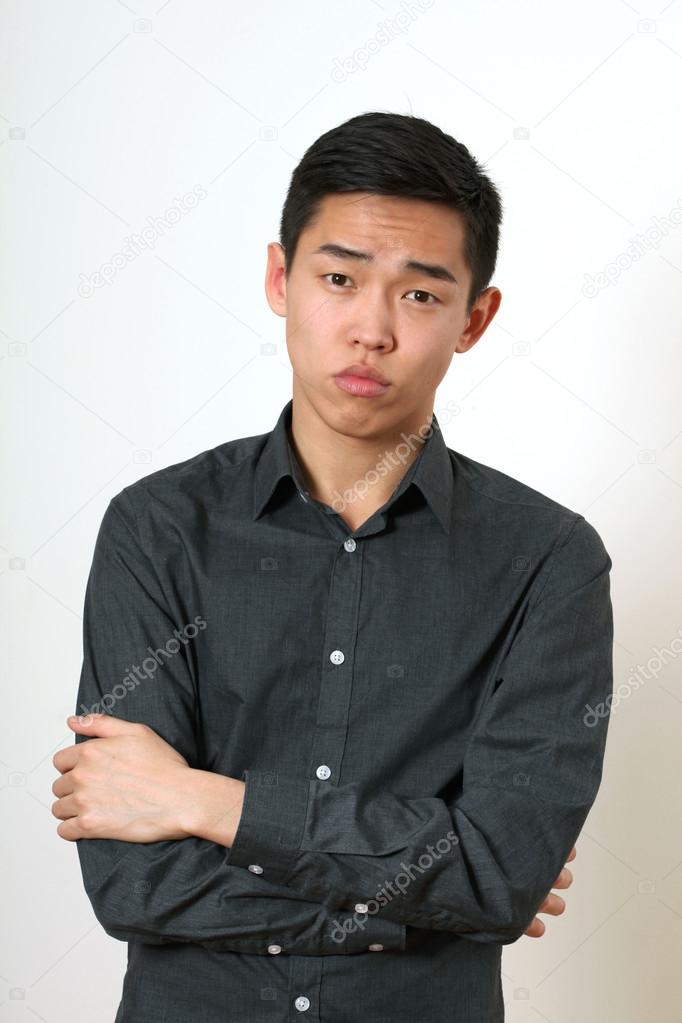 Asian man with crossed hands