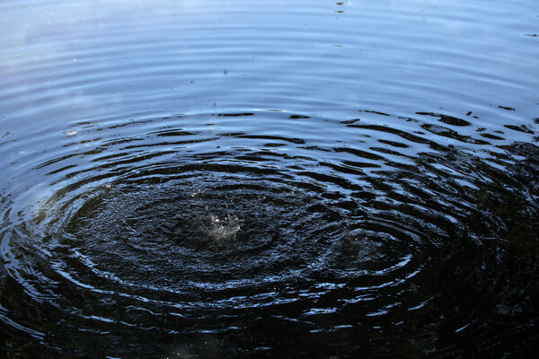 Capillary waves produced by two droplets