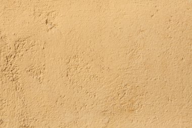 Yellow stucco wall.