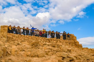 JUDEA, ISRAEL, DECEMBER - 2019 - Tourists crowd at masada national park fort, Judea, Israel clipart