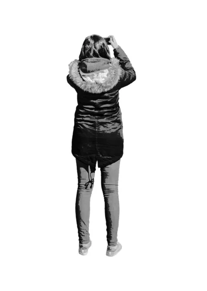 携帯電話のグラフィックシルエットイラストで写真を撮る冬服を持つ大人の女性 — ストック写真