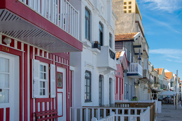 Perspective view of traditional striped houses in Costa Nova, Aveiro,  Portugal, symbol of local identity and colorful architecture